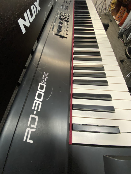 ROLAND RD300NX STAGE PIANO WITH KC60 AMP W/ STAND AND PEDALS